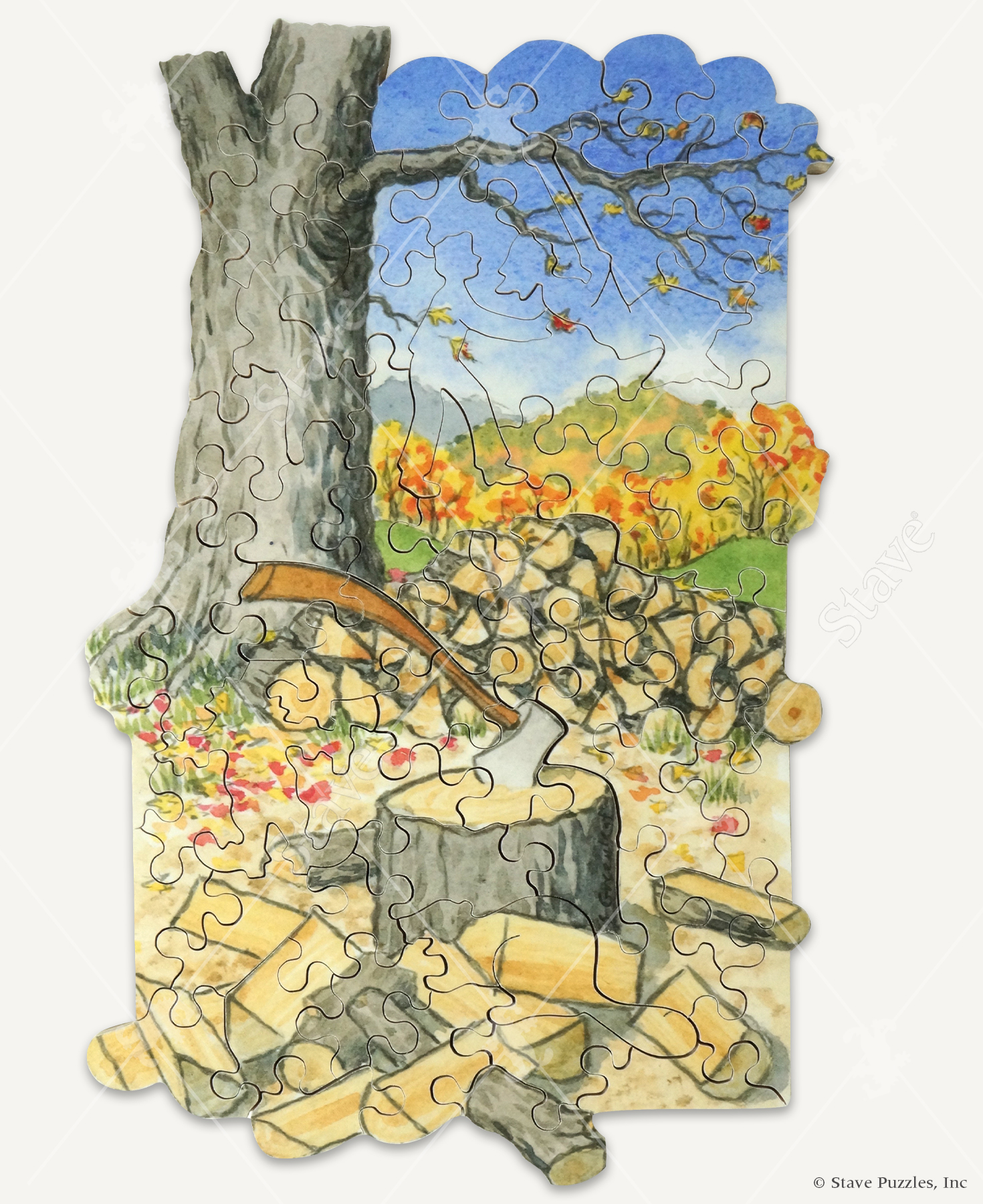 Strike A Cord wooden jigsaw puzzle reveals an ax stuck in a tree trunk with piles of split wood surrounding it during the autumn season.