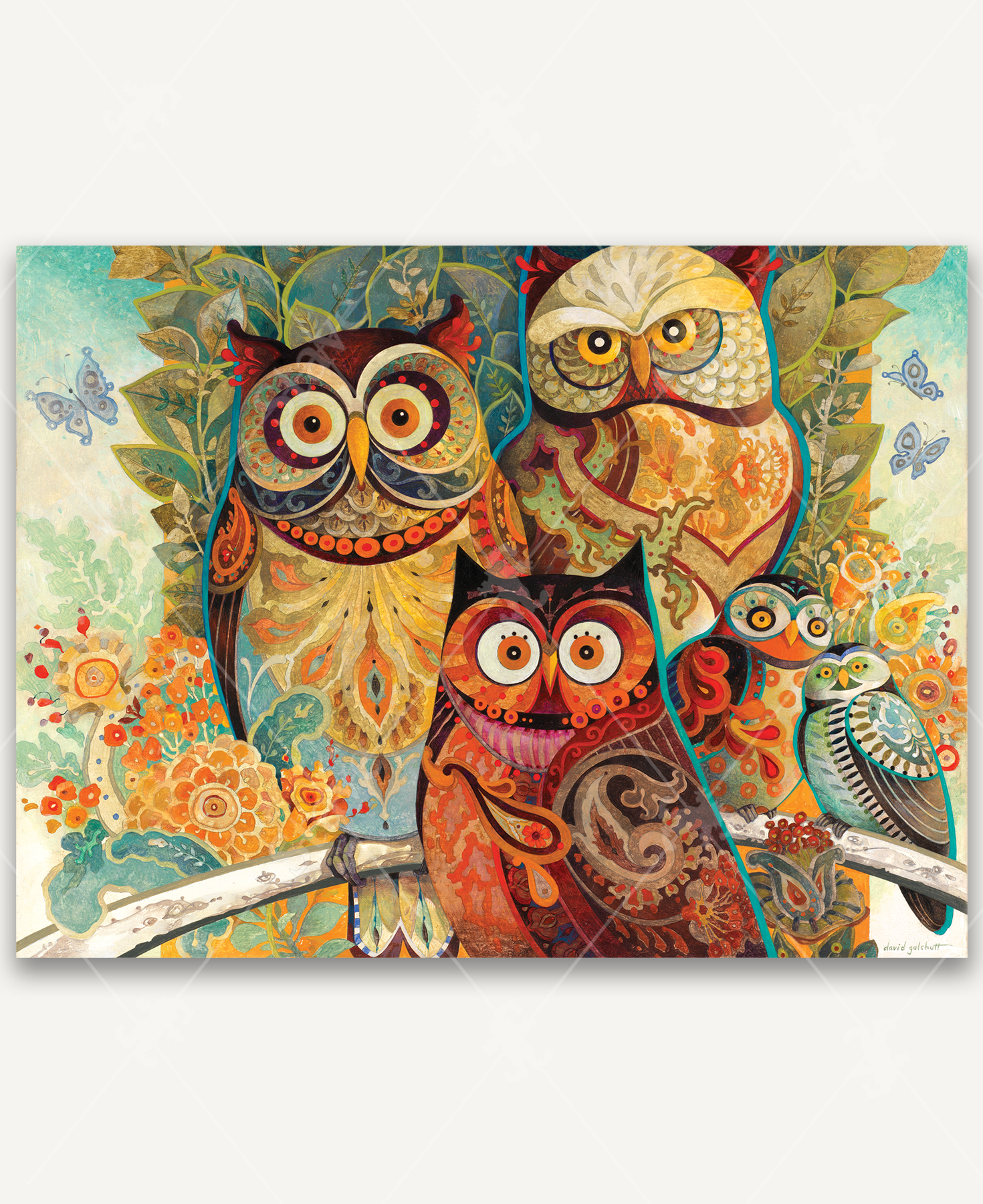 Wise Guys wooden jigsaw puzzle transports viewers to the forest as they come eye-to-eye with five owls. The owls sit next to each other on a tree branch, while one owl sits infront of them. The various sized owls have big bright eyes that stare straight ahead with their bodies decorated in paisley designs. The background is filled with leaves and flowers.