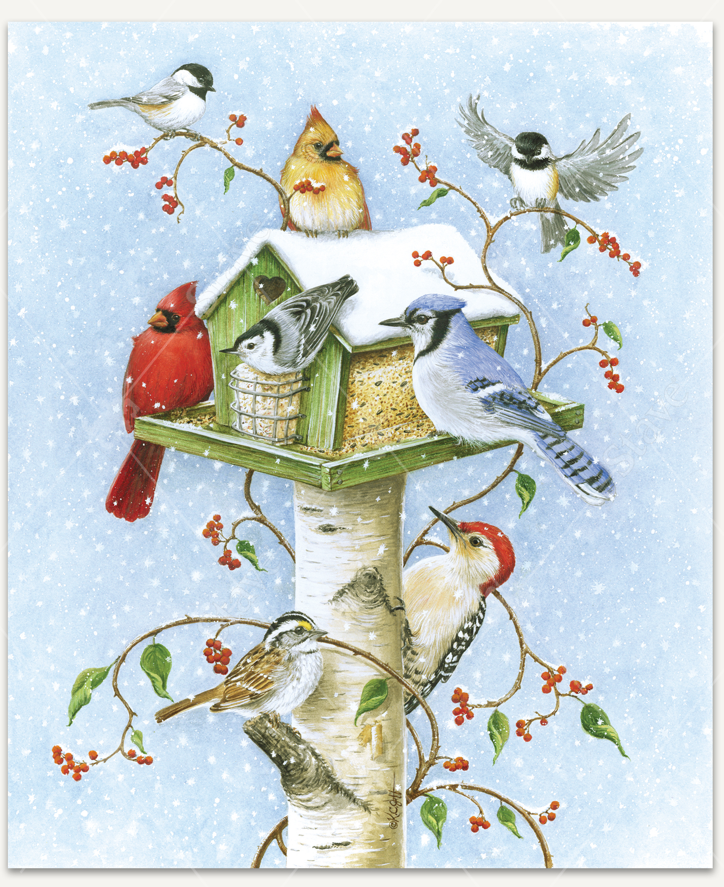 Gather In Harmony wooden jigsaw puzzle presents a green birdhouse feeder mounted on a birch post. Snowflakes fall and cover the top of the feeder. Chickadees, cardinals, a blue jay, a white throated sparrow, and a woodpecker gather to eat the seeds.