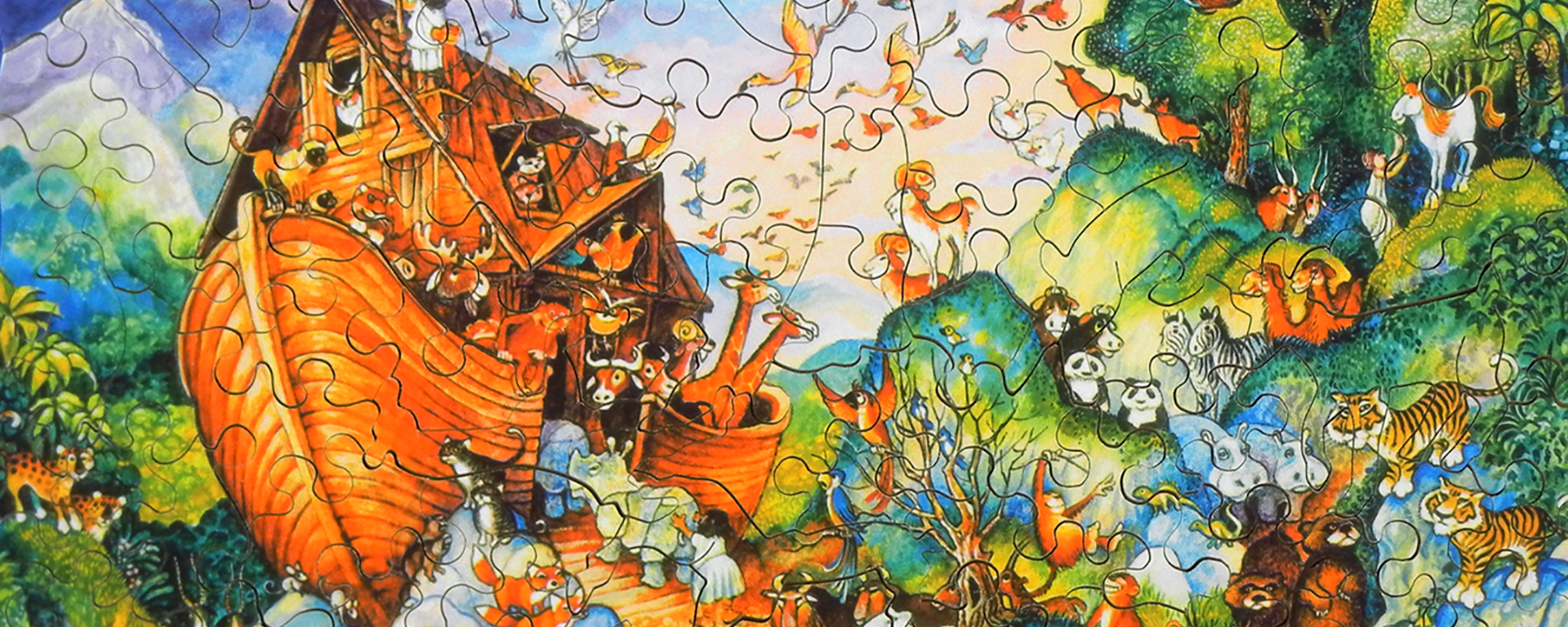 Wooden Noah's Ark jigsaw puzzle featuring animals being guided into the ark two by two.