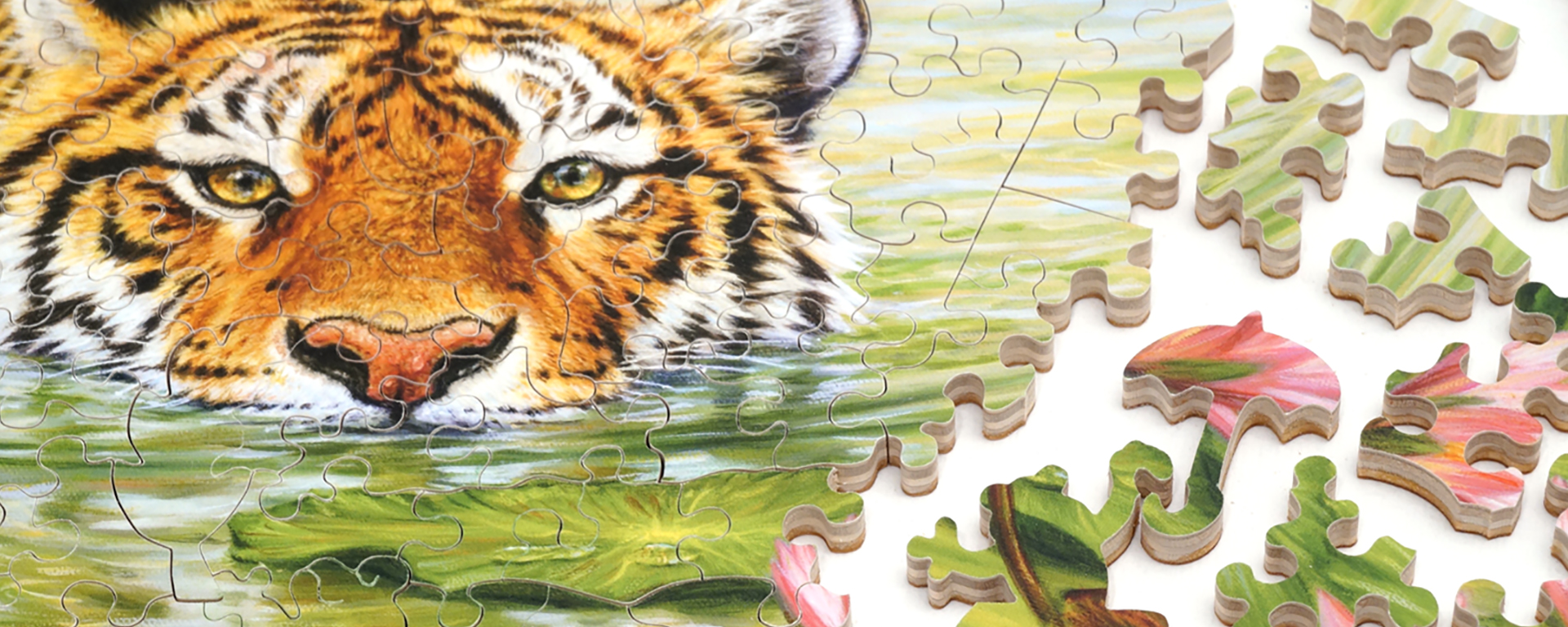 Wooden wild cat jigsaw puzzle featuring a close up of a tiger swimming through lotus flowers in the water.