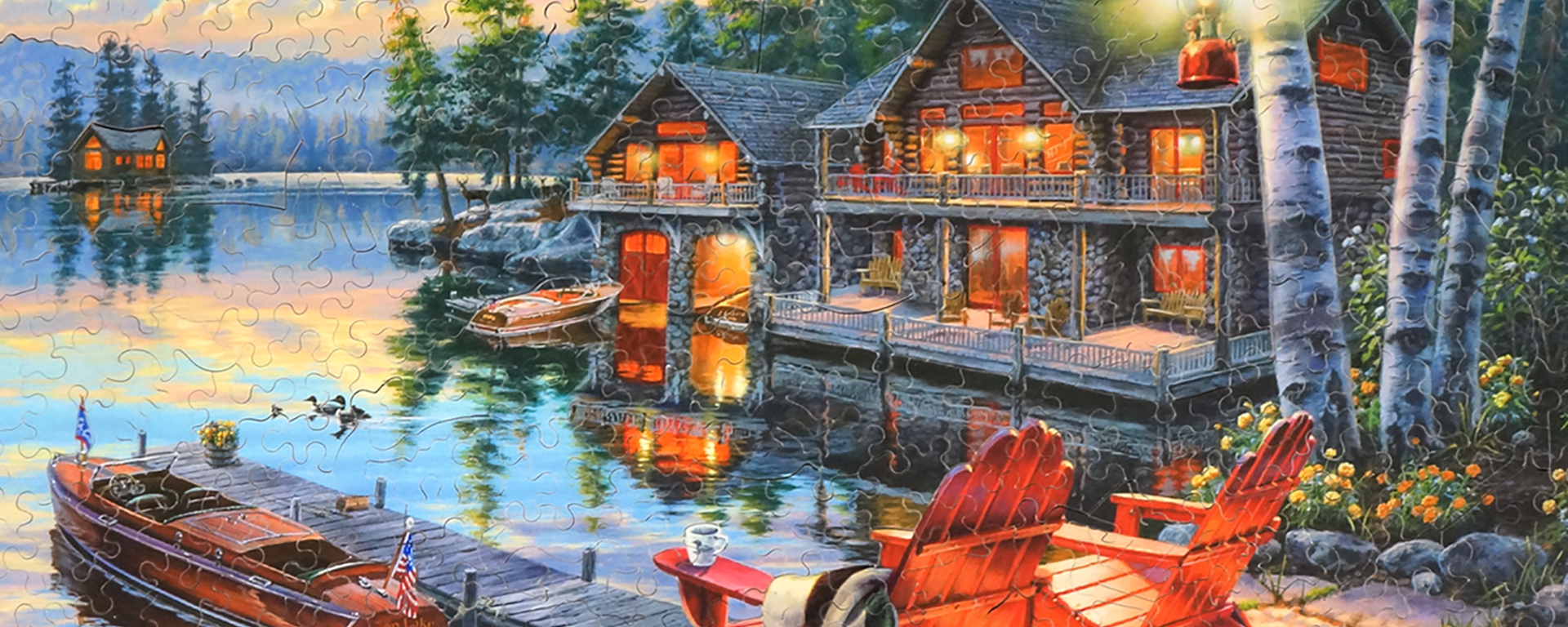 Wooden cabin jigsaw puzzle depicting a peaceful scene of a beautiful mountain landscape with lush green trees on the lakes edge and elaborate two story cabins nestled in the woods