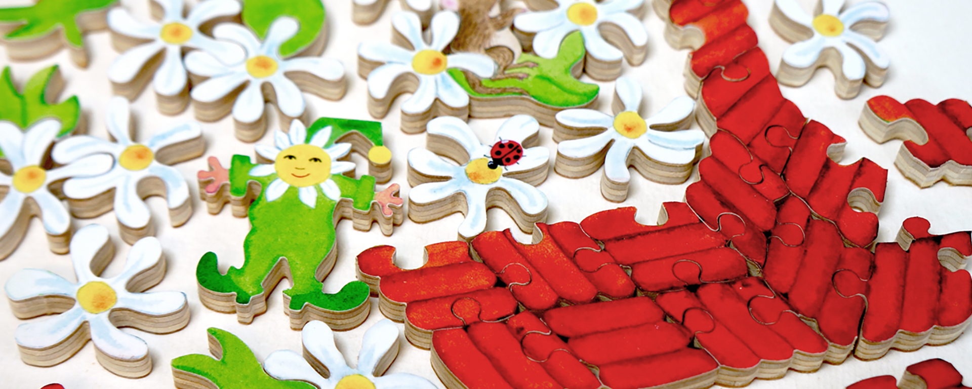 Wooden summer florals jigsaw puzzle in progress featuring daisies in a red basket.
