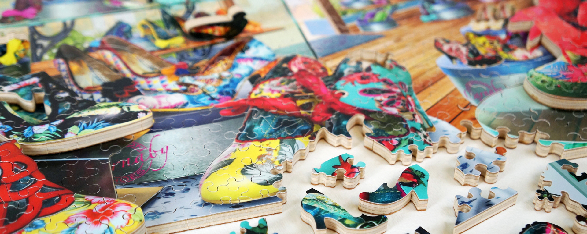 Wooden shopping puzzle in progress depicting a variety of shoes at the Carnaby Shoe Shop.
