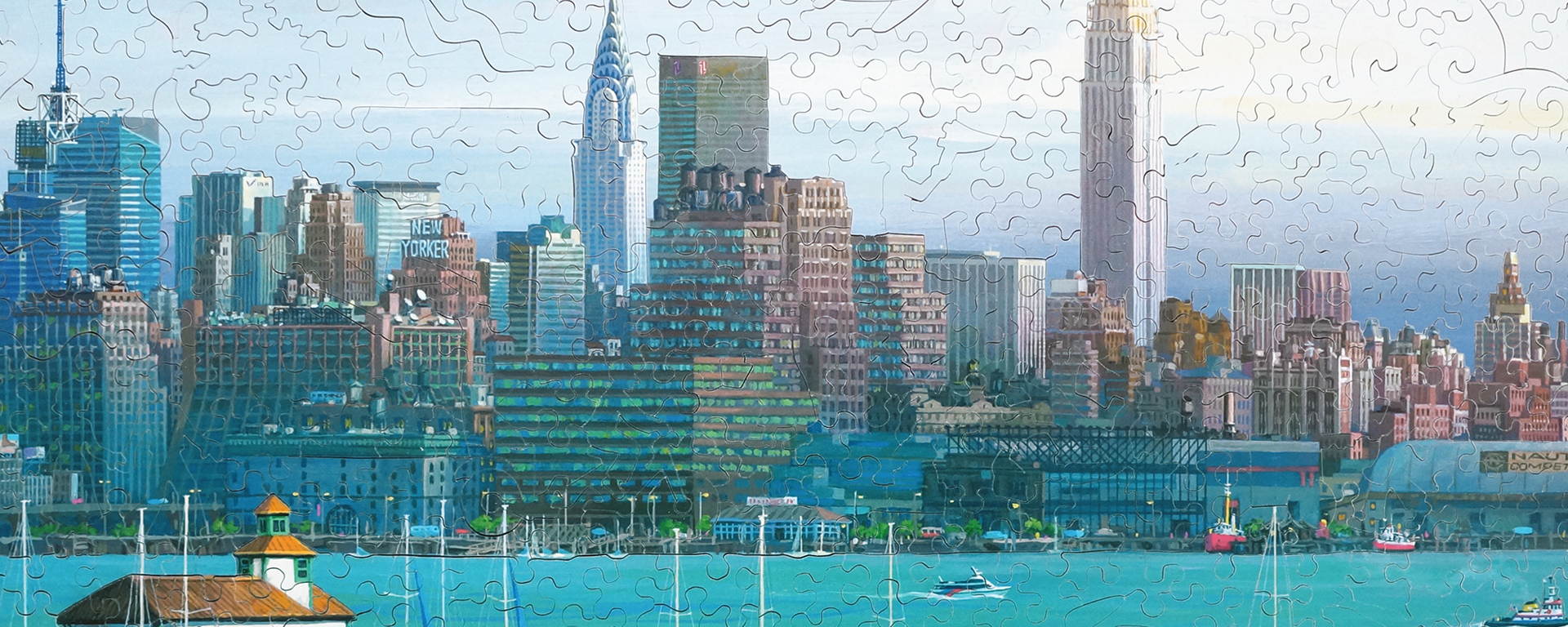 Wooden cityscape puzzle featuring famous buildings from the New York skyline such as the Chrysler building, the empire state building, and the New Yorker building.