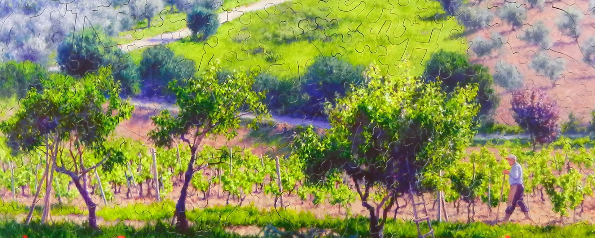 Wooden vineyard puzzle featuring a viticulturist walking through the vineyard.