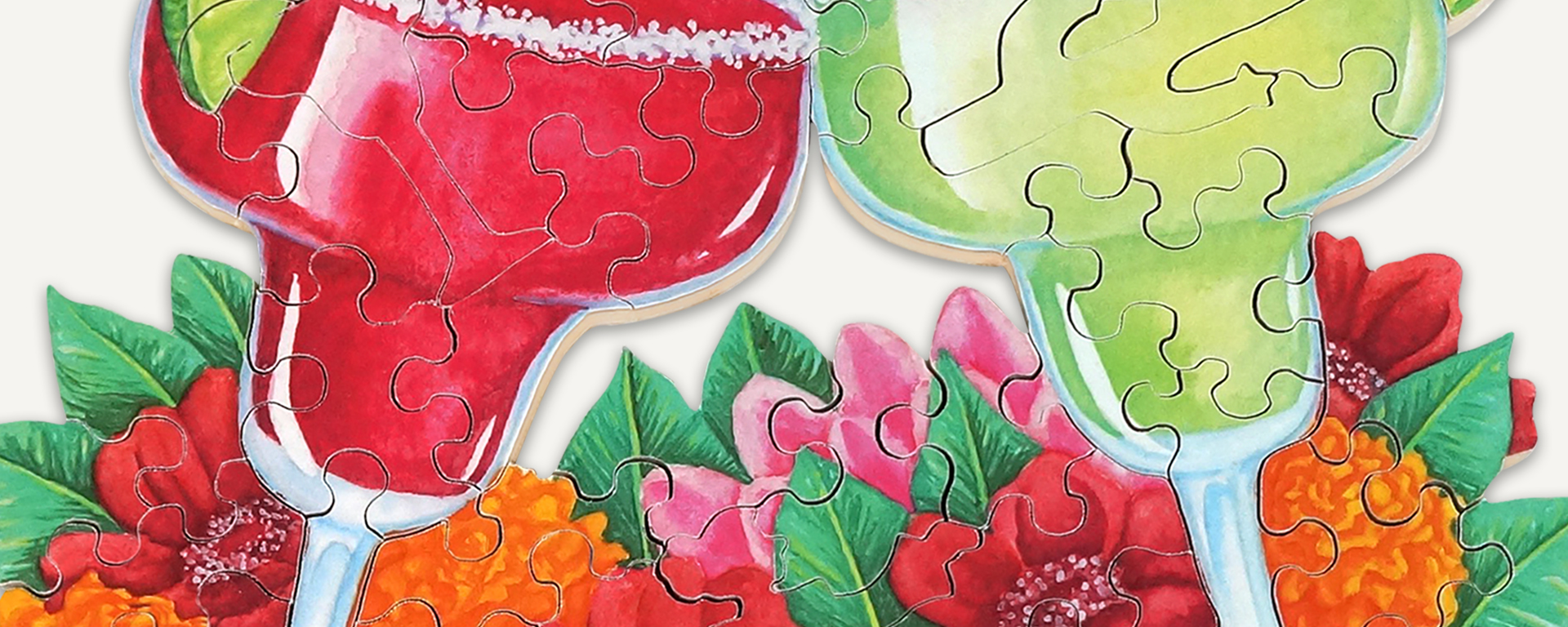 Wooden jigsaw Cinco de Mayo puzzle of green and red margartias with flowers in the background.