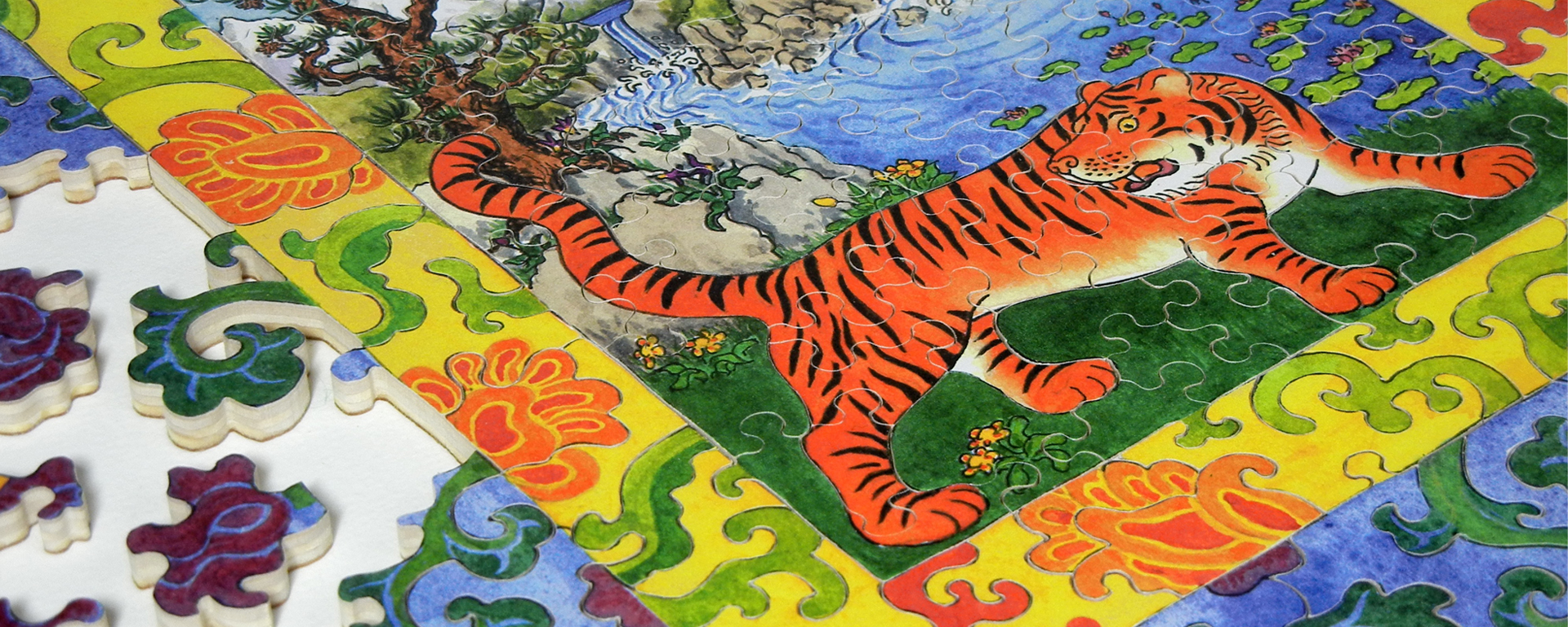 Wooden treat puzzle depicting a Tibetan thangka painting of a tiger.