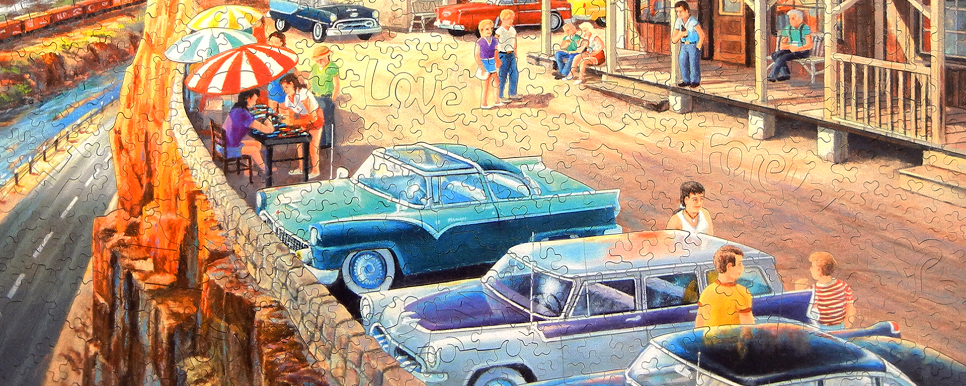 Wooden automobile puzzle portraying 1960s cars parked at a Scenic Overlook by artist Ken Zylla.