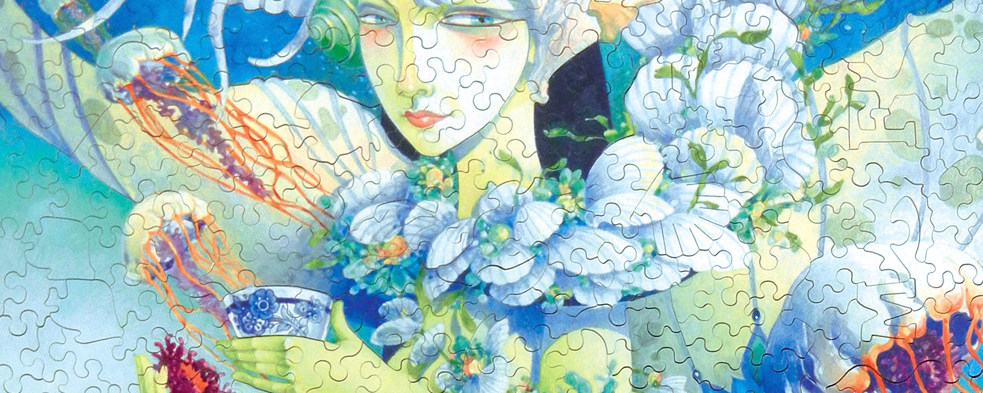 Wooden mermaid puzzle featuring a beautiful mermaid drinking a cup of tea out of a porcelain cup adorned with shells and surrounded by jellyfish.