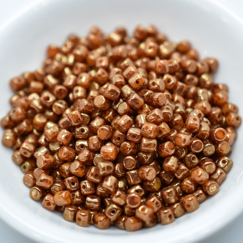 Minos Par Puca® 5 grams - Orange Opal Bronze - 2.5x3mm Cylinder Czech Glass Beads