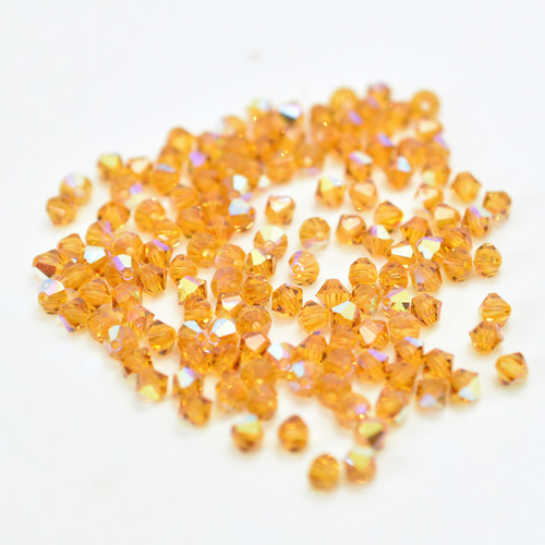 Preciosa 4mm Bicone Machine Cut Crystal Topaz AB (24 Beads)