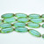 8x20mm Long Oval Table Cut Bottle Green Picasso, 12 Beads Czech Glass