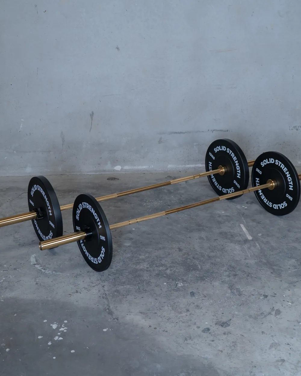 Solid Strength Olympic barbells with bumper plates
