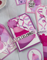 Handmade greeting tag with party hat on it and let's celebrate sentiment on it.