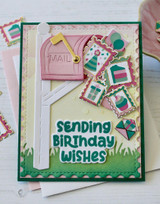 Handmade greeting card with birthday envelopes on it and a mailbox with sending birthday wishes sentiment on it.