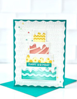 Handmade greeting card with cake on it and happy birthday sentiment on it.