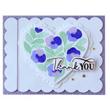 Handmade greeting card with floral heart on it and thank you sentiment on it.