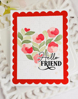 Handmade greeting card with floral heart on it and hello friend sentiment on it.