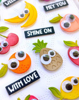Upclose of handmade greeting card with fruits on it and various sentiments on it.