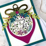 Handmade greeting card with ornament on it and merry & bright sentiment on it.