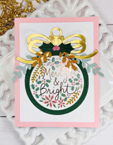 Handmade greeting card with ornament on it and Merry & Bright sentiment on it.