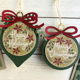 Two handmade ornaments with various Christmas sentiments on each.