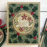Four handmade greeting cards with circle on it and peace on earth sentiment on it.