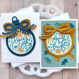 Two handmade greeting cards with ornaments on each with bows and various holiday sentiments on each.