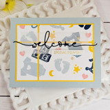 Handmade greeting card with baby decor on it and welcome, special delivery sentiment on it.