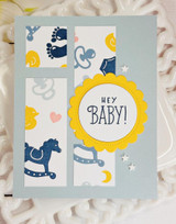 Handmade greeting card with baby decor on it and hey baby sentiment on it.