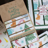 Handmade greeting card with Christmas decor on it and Have a Holly Jolly Christmas and Happy Holidays sentiments on it.