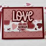Handmade greeting card with hearts on it and love you lots sentiment on it.