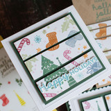 Handmade greeting card with Christmas decor on it and happy holidays sentiment on it.