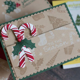 Handmade greeting card with candy canes on it and 'tis the season sentiment on it.