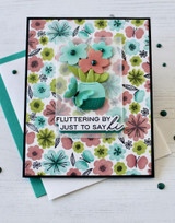 Handmade greeting card with flowers on it and a butterflies and fluttering by just to say hi sentiment on it.