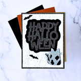 Handmade greeting card with a cat and bats on it and happy halloween sentiment on it.