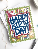 Handmade greeting card with party postage on it and happy birthday sentiment on it.