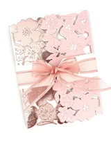 Handmade greeting card with flowers on it and a bow.