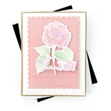 Handmade greeting card with flower on it and thank you sentiment on it.