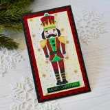 Handmade greeting card with a nutcracker on it and Merry Christmas sentiment on it.