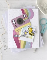 Handmade greeting card with polaroid on it and picture of a bumble bee and hello sentiment on it.
