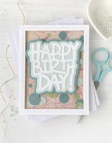 Handmade greeting card with circles on it and happy birthday day sentiment on it.