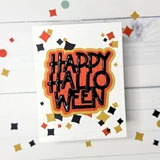 Handmade greeting card with happy halloween sentiment on it and various inverted diamond shapes on it.