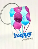 Handmade gift tag with happy everything sentiment on it and balloons.