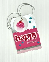 Handmade gift tag with happy birthday sentiment on it and a cupcake on it.