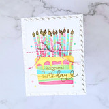 Handmade greeting card with cake on it and happiest birthday sentiment on it.