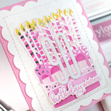 Handmade greeting card with cake on it and  birthday wishes sentiment on it.