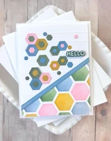 Handmade greeting card with hexagons on it and hello sentiment on it.