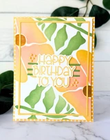 Handmade greeting card with flowers on it and happy birthday to you sentiment on it.